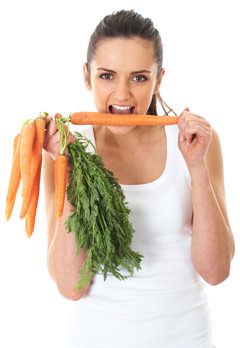 woman-holding-a-bundle-of-carrots